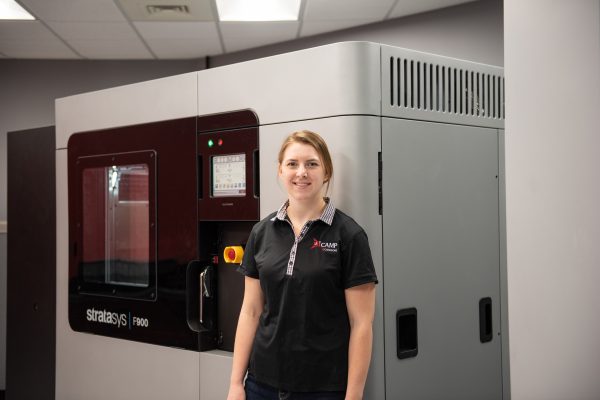 Sarah Rienguette, Project Leader at ICAMP, with the newly installed Stratasys F900