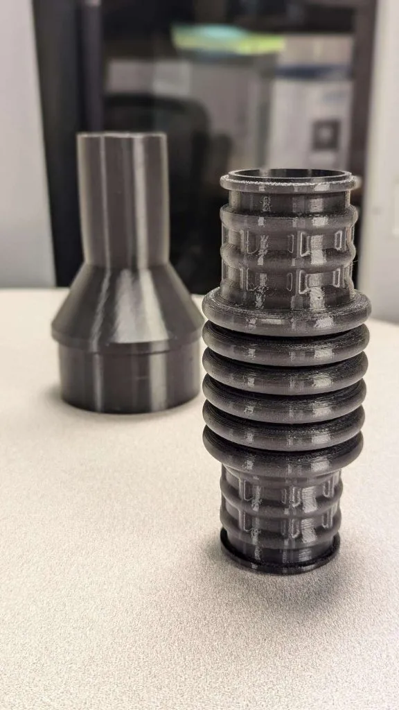 Two different flexible air intake hose adapters